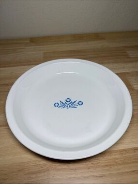 Vintage CorningWare 9-inch pie plate featuring the classic Blue Cornflower.